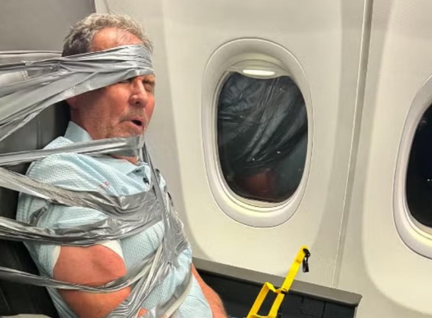 American Airlines uçağında koltuğa bantlanan adam konuştu